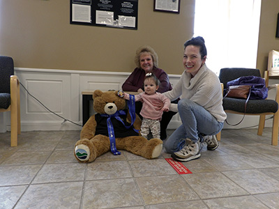 Michelle, Penny, and Julia with Large Stuffed Teddy Bear