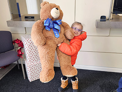 Elayna with Large Stuffed Teddy Bear