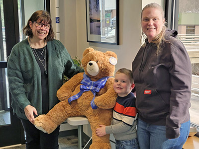 Rebecca, Zander, Dawn with Large Stuffed Teddy Bear