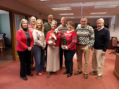 Group of People Wearing Christmas Sweaters