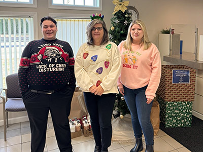 Group of People Wearing Christmas Sweaters